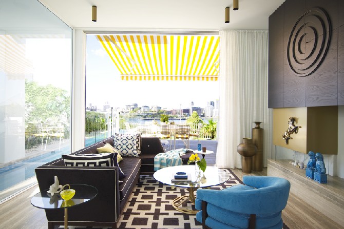 modern living areas by  by G. Natale Love the pops of turquoise and yellow alongside the black and gold anchors in this livin