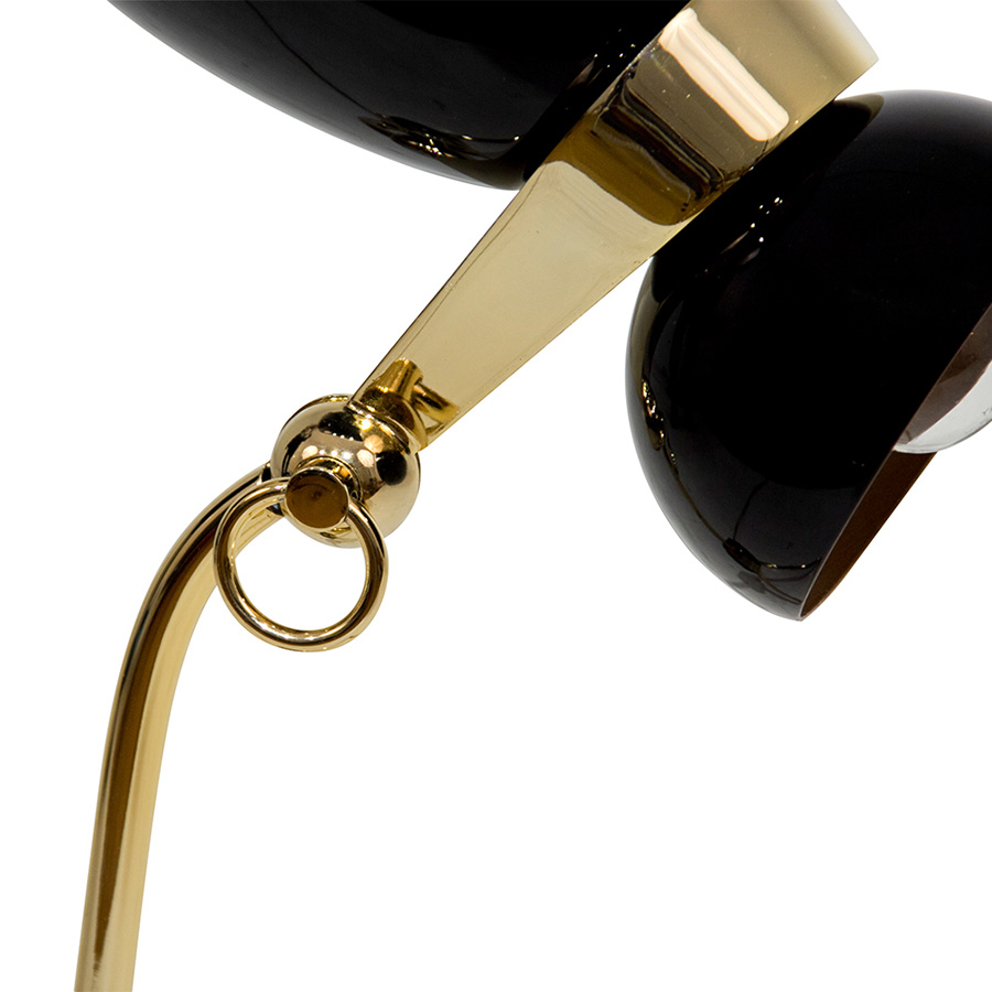Amy vintage table lamp is a lighting design inspired by one of the greatest British singers and songwriters of all times. With a glossy black lampshade that resembles her iconic hair and a small brass detail that reminds us of her golden earring, 100% handmade in Portugal, with a gold-plated finish and a glossy black coat applied to the body, this small brass lamp is perfect for a vintage bedroom, or a retro home office.