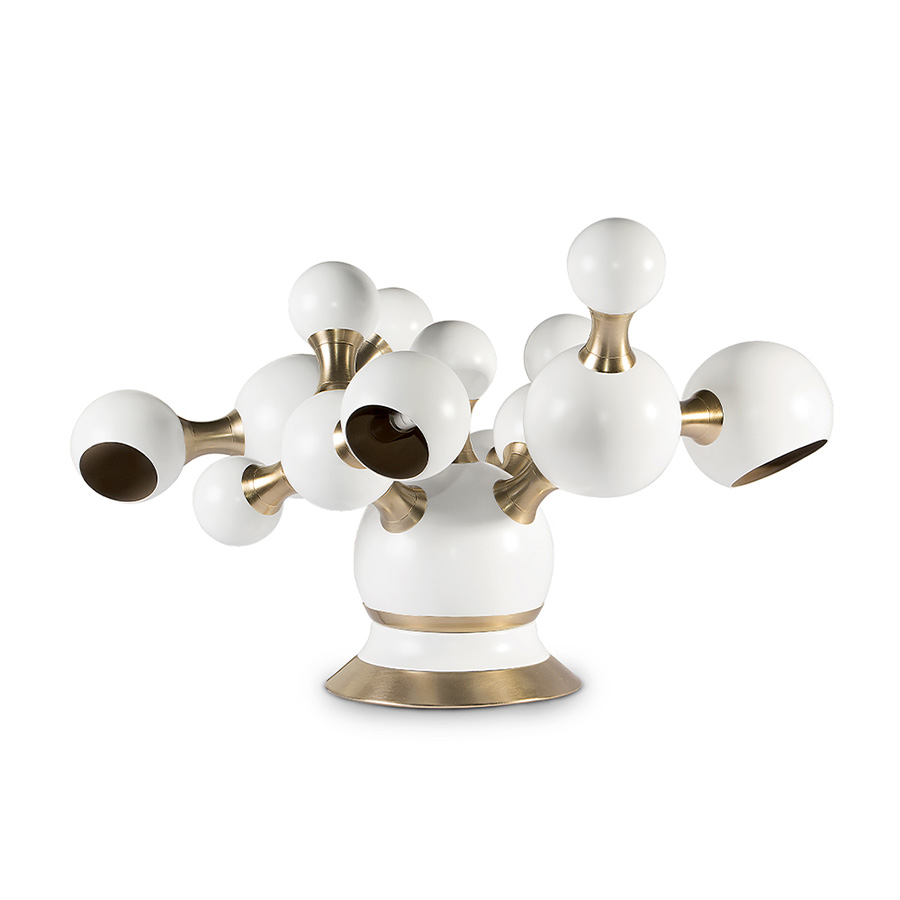 Atomic mid-century desk lamp was inspired by the molecular composition of the atom. With a body handmade in brass and steel, this large table lamp features a set of 4 round spotlights all arranged in an abstract organic composition. Weighing in at almost 20 pounds, Atomic table light has several gold-plated elements that turn it into a sophisticated option perfect for a modern home office, or a contemporary living room.