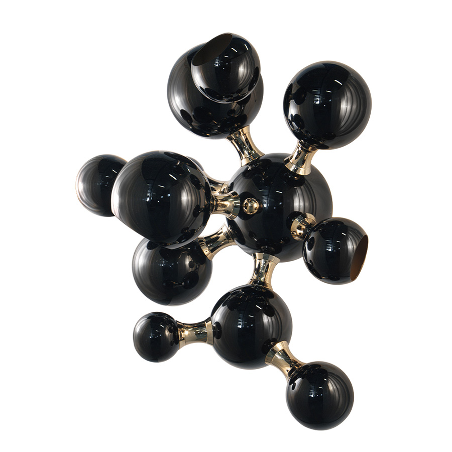 Atomic wall light is a mid-century modern lighting design inspired by the atomic discoveries of the mid-20th century. With multiple round shades that resemble the molecular composition of the atom, this interior wall light can give a fun twist to a contemporary home decor. Its body is handmade in brass and steel, with both a glossy black and a gold-plated finish.