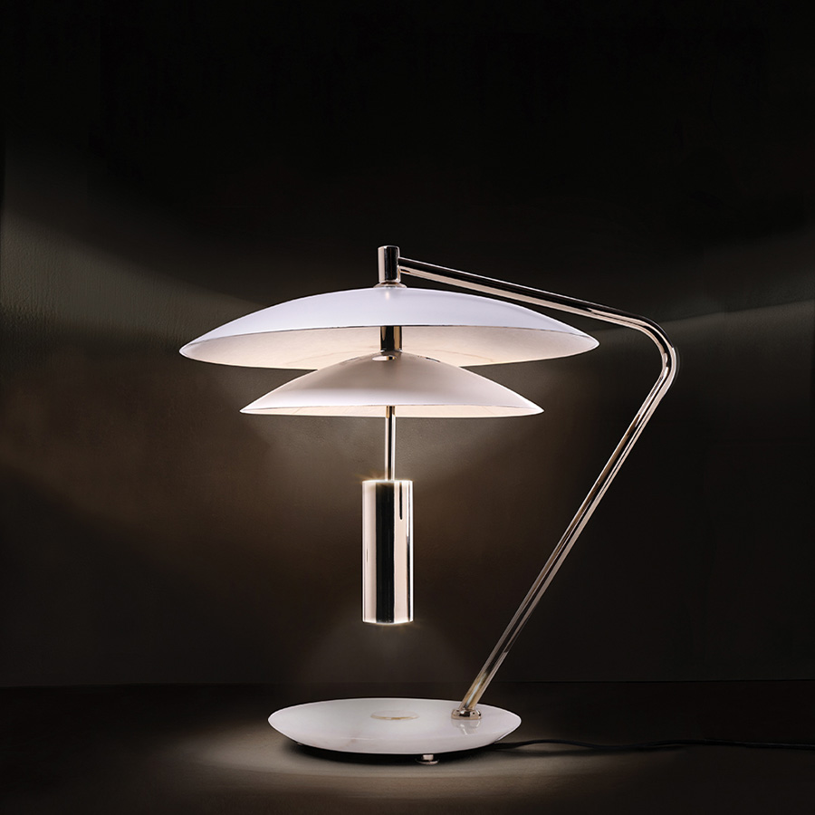 Basie table light is a vintage mid-century lamp with distinct features that make it stand out in any room setting. Handmade in brass, with an Aluminium shade and a marble base, it features a top cover that can be customized with any RAL color of your choosing. Looking its best in more formal settings, this graciously large table lamp is the perfect fit for a classic living room or entryway.