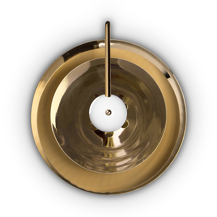 Basie wall light fixture is a modern representation of the sci-fi aesthetics of the 1960s. The vintage mid-century lamp has a set of distinctive features which make it a stunning statement piece. It is an indoor wall light handmade in brass, with a center shade made in Aluminium and a mesmerizing gold-plated standard finish. The lamp shade is lacquered a glossy white for a more modern look.