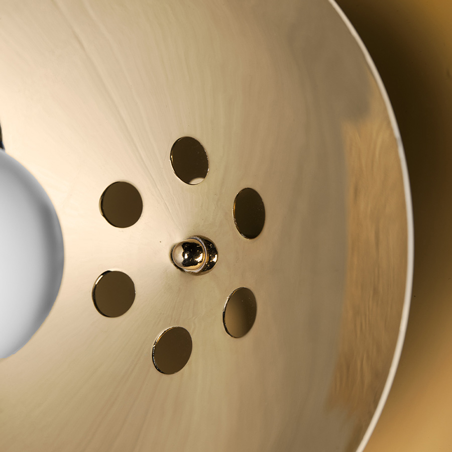 Basie wall light fixture is a modern representation of the sci-fi aesthetics of the 1960s. The vintage mid-century lamp has a set of distinctive features which make it a stunning statement piece. It is an indoor wall light handmade in brass, with a center shade made in Aluminium and a mesmerizing gold-plated standard finish. The lamp shade is lacquered a glossy white for a more modern look.