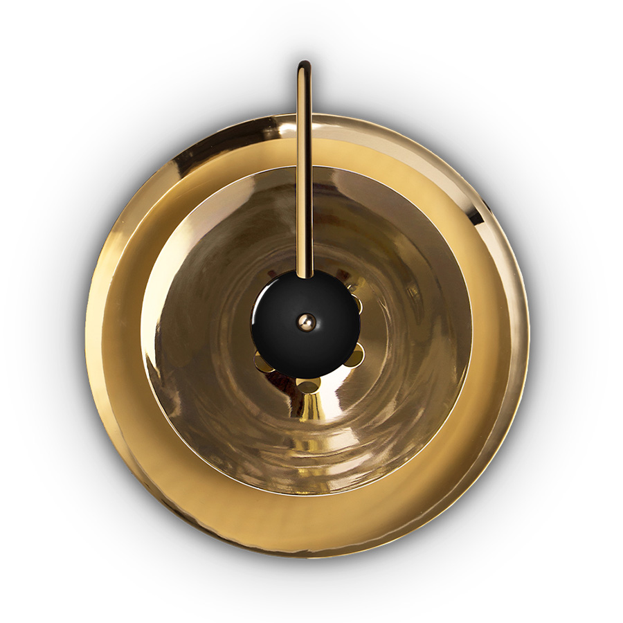 Basie wall light fixture is a modern representation of the sci-fi aesthetics of the 1960s. The vintage mid-century lamp has a set of distinctive features which make it a stunning statement piece. It is an indoor wall light handmade in brass, with a center shade made in Aluminium and a mesmerizing gold-plated standard finish. The lamp shade is lacquered a glossy white for a more modern look.