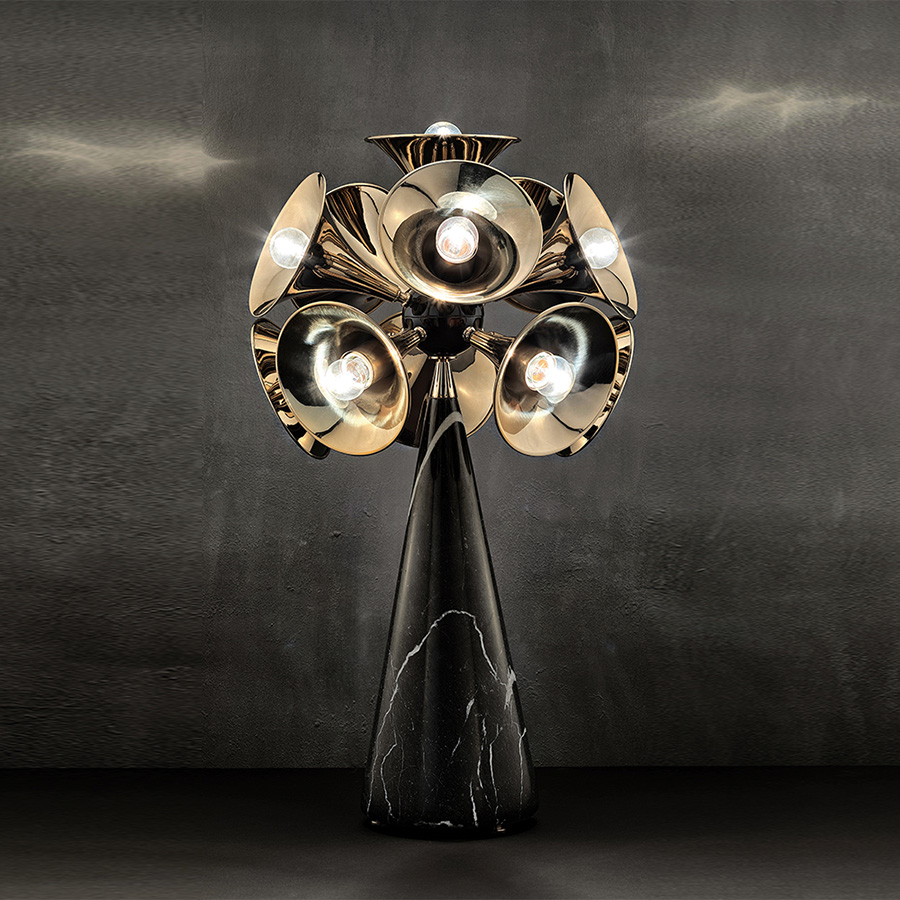 The embodiment of the most famous wind instrument of them all, Botti mid-century table lamp was inspired by a classic trumpet. Its unique shades are handmade in brass with a gold-plated finish to resemble a real trumpet. The base can be produced in Nero Marquina or white marble, as well as black nickel or any other finish of your choosing. It is a tall table lamp, very hard to miss, making it the ideal choice for a classic living room design.