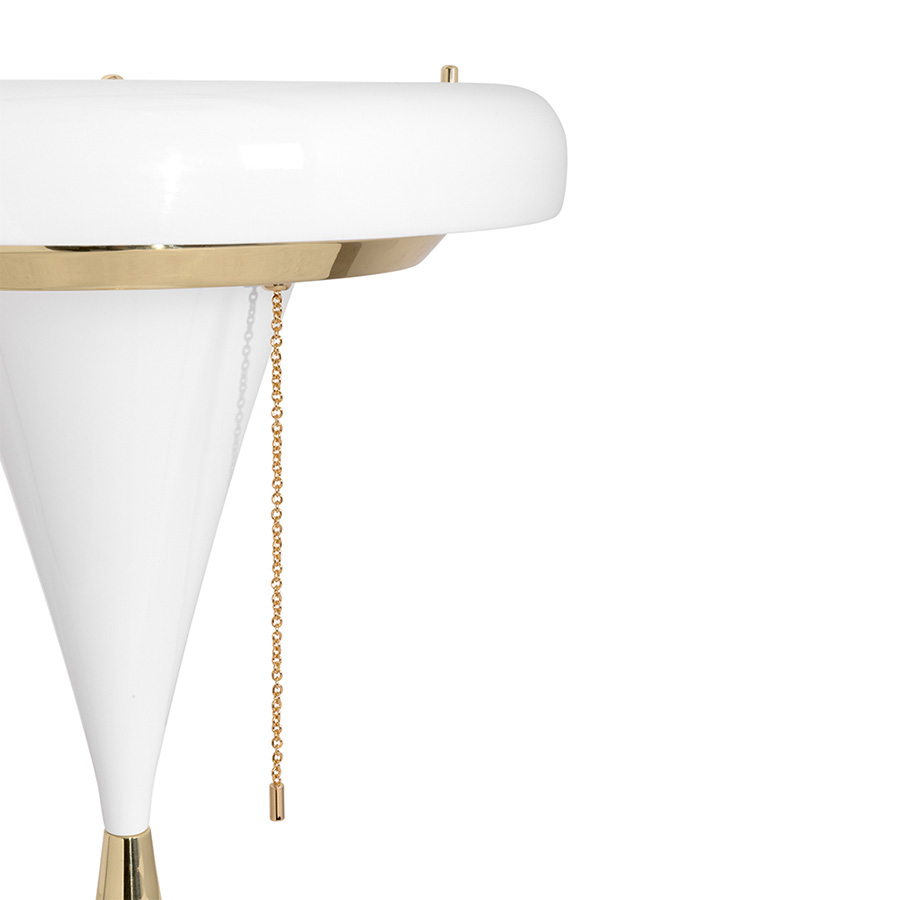 A mid-century lighting design, this iconic take on a stilnovo design has taken form of this glamorous table lamp. With a soft casting light this modern lighting fixture has all the glamour of the mid-century design iconic lines. The simple and well cut lines of this modern table lamp will fit into any luxurious decor. Handmade in brass and acrylic, this vintage modern table lamp will be the light of the room.
