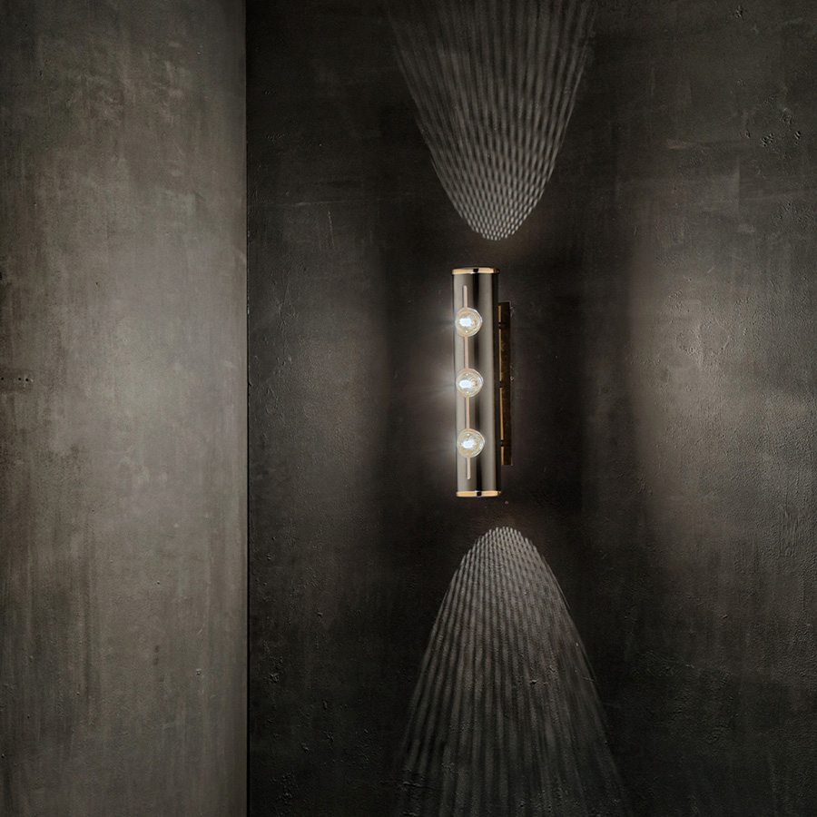 Inspired by the rock and roll world and the legendary Chuck Berry, DelightFULL has created Chuck 3 wall light. This piece is inspired in the original Chuck Wall, but has three bulbs for a new design. This minimalist wall sconce is all about emotion and rhythm, conveying a vibrant feeling to any room. Its small body and mount are handmade in brass with a standard gold-plated finish, whilst the actual lampshade is built in Aluminium and features a glossy black lacquer.