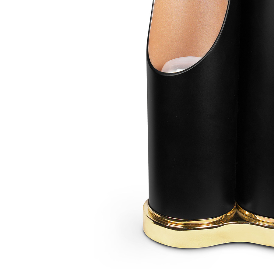 The mid-century Coltrane table light is a modern lighting fixture, which embodies the contemporary principles of minimalism. With this in mind, DelightFULL’s designers came up with a minimal black table lamp with three tubes that cast the most soothing glaze. This modern desk lamp is handmade in brass and steel, with a gold-plated base that is topped up with a matte black finish on the three shades. It serves as a great bedside table lamp, as well as a unique entryway table light.