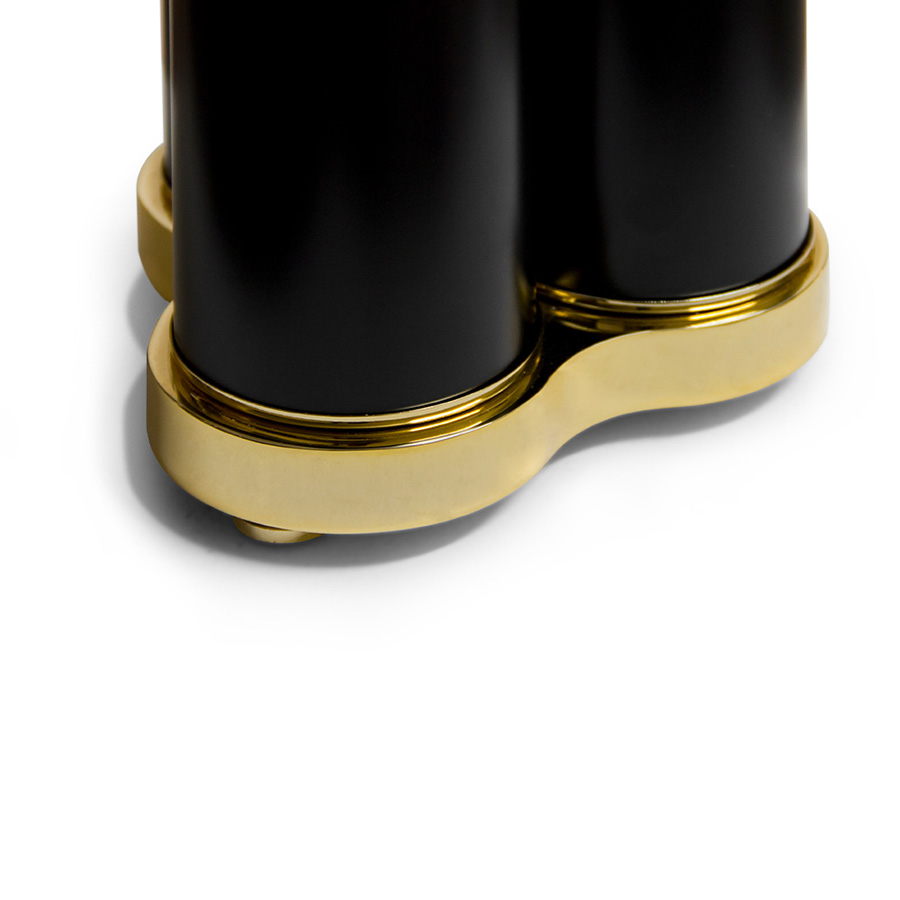 The mid-century Coltrane table light is a modern lighting fixture, which embodies the contemporary principles of minimalism. With this in mind, DelightFULL’s designers came up with a minimal black table lamp with three tubes that cast the most soothing glaze. This modern desk lamp is handmade in brass and steel, with a gold-plated base that is topped up with a matte black finish on the three shades. It serves as a great bedside table lamp, as well as a unique entryway table light.