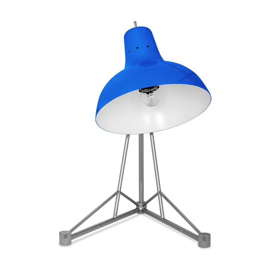 It is a handmade lamp built with materials such as brass and Aluminium. Brass was used on the body, whilst Aluminium was chosen for the shade. The Aluminium shade is lacquered a glossy red on the outside and matte white on the inside, while for the body a nickel-plated finish was chosen. However, both these colors and finishes can be customized according to your needs. having a movable and adjustable shade, that casts light to where it is needed.