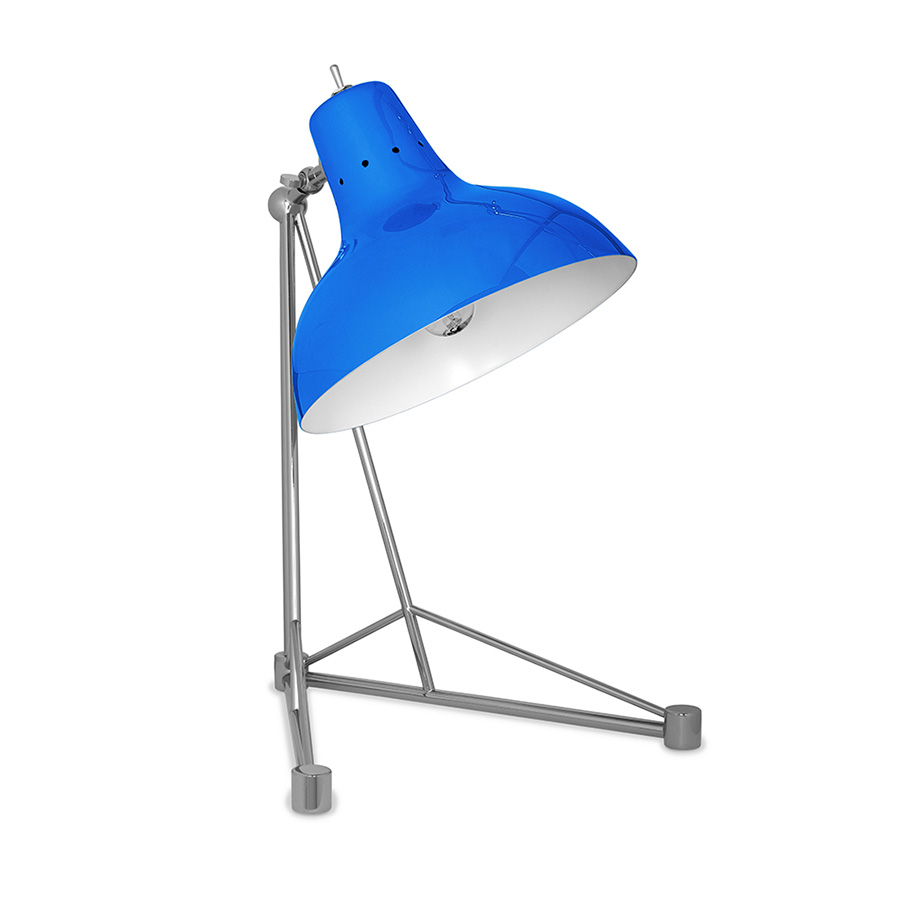 It is a handmade lamp built with materials such as brass and Aluminium. Brass was used on the body, whilst Aluminium was chosen for the shade. The Aluminium shade is lacquered a glossy red on the outside and matte white on the inside, while for the body a nickel-plated finish was chosen. However, both these colors and finishes can be customized according to your needs. having a movable and adjustable shade, that casts light to where it is needed.