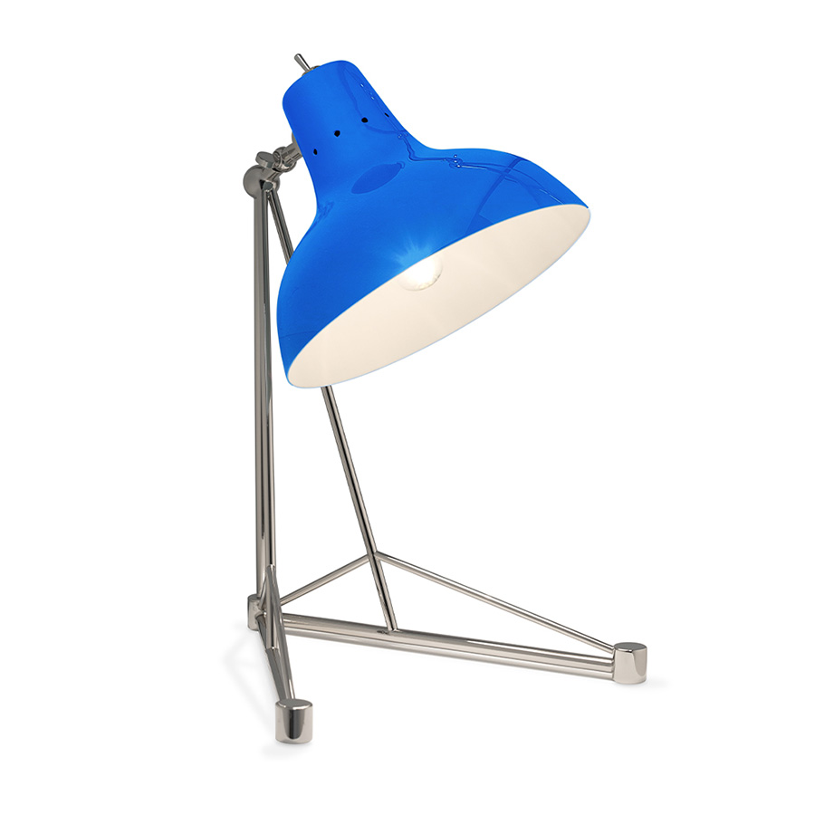 It is a handmade lamp built with materials such as brass and Aluminium. Brass was used on the body, whilst Aluminium was chosen for the shade. The Aluminium shade is lacquered a glossy red on the outside and matte white on the inside, while for the body a nickel-plated finish was chosen. However, both these colors and finishes can be customized according to your needs. having a movable and adjustable shade, that casts light to where it is needed.