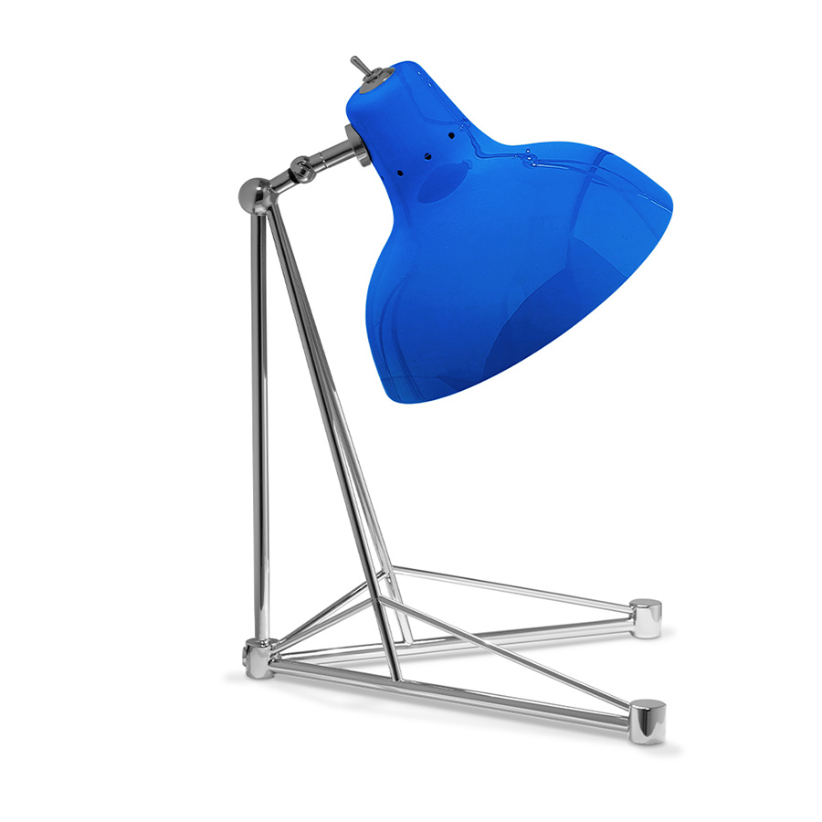 It is a handmade lamp built with materials such as brass and Aluminium. Brass was used on the body, whilst Aluminium was chosen for the shade. The Aluminium shade is lacquered a glossy red on the outside and matte white on the inside, while for the body a nickel-plated finish was chosen. However, both these colors and finishes can be customized according to your needs. having a movable and adjustable shade, that casts light to where it is needed.