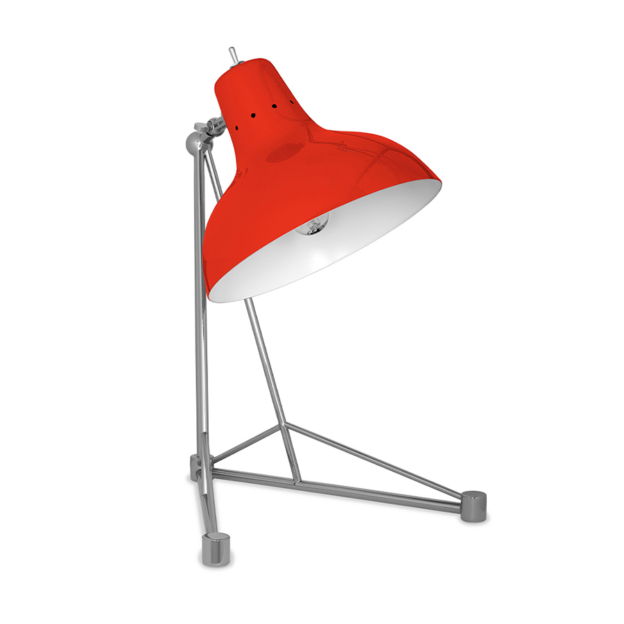 It is a handmade lamp built with materials such as brass and Aluminium. Brass was used on the body, whilst Aluminium was chosen for the shade. The Aluminium shade is lacquered a glossy red on the outside and matte white on the inside, while for the body a nickel-plated finish was chosen. However, both these colors and finishes can be customized according to your needs. having a movable and adjustable shade, that casts light to where it is needed.