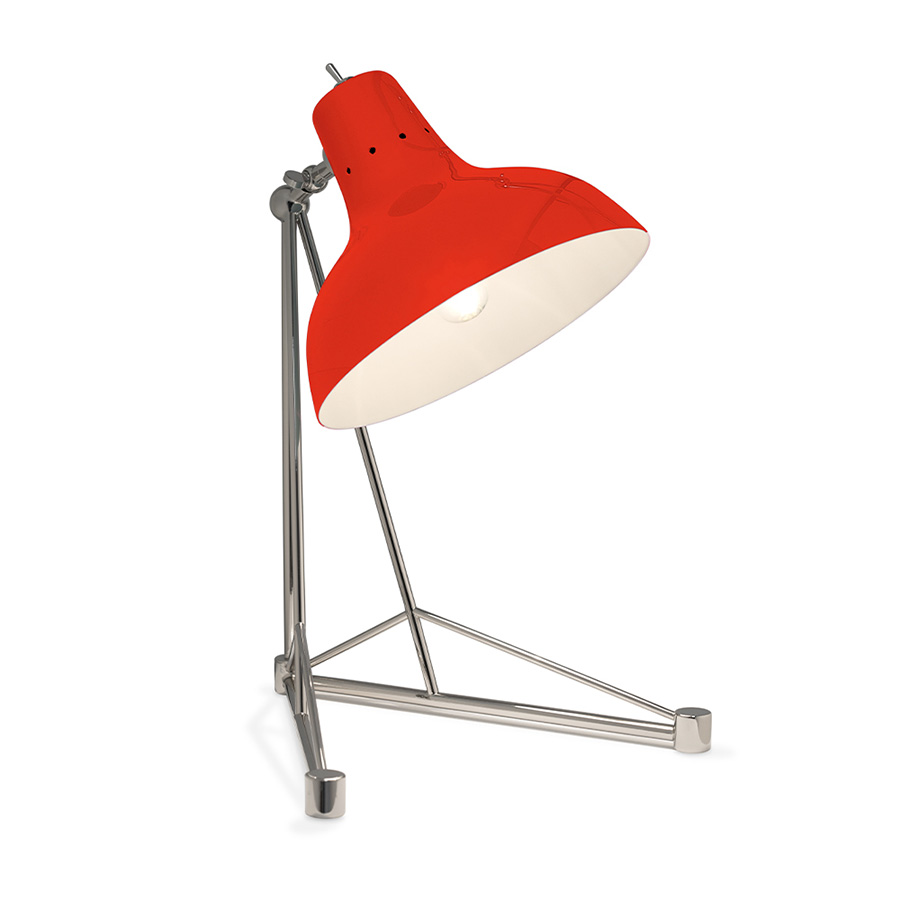 It is a handmade lamp built with materials such as brass and Aluminium. Brass was used on the body, whilst Aluminium was chosen for the shade. The Aluminium shade is lacquered a glossy red on the outside and matte white on the inside, while for the body a nickel-plated finish was chosen. However, both these colors and finishes can be customized according to your needs. having a movable and adjustable shade, that casts light to where it is needed.