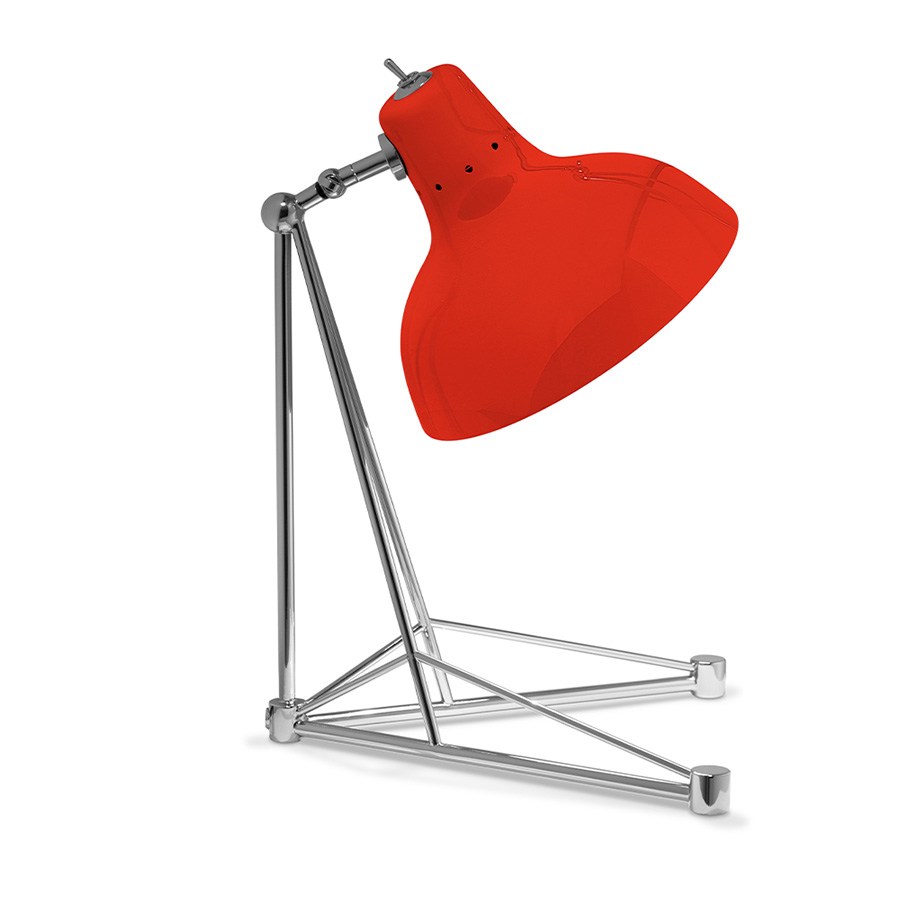 It is a handmade lamp built with materials such as brass and Aluminium. Brass was used on the body, whilst Aluminium was chosen for the shade. The Aluminium shade is lacquered a glossy red on the outside and matte white on the inside, while for the body a nickel-plated finish was chosen. However, both these colors and finishes can be customized according to your needs. having a movable and adjustable shade, that casts light to where it is needed.
