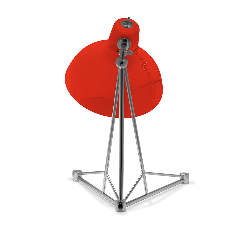 It is a handmade lamp built with materials such as brass and Aluminium. Brass was used on the body, whilst Aluminium was chosen for the shade. The Aluminium shade is lacquered a glossy red on the outside and matte white on the inside, while for the body a nickel-plated finish was chosen. However, both these colors and finishes can be customized according to your needs. having a movable and adjustable shade, that casts light to where it is needed.