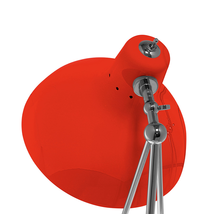 It is a handmade lamp built with materials such as brass and Aluminium. Brass was used on the body, whilst Aluminium was chosen for the shade. The Aluminium shade is lacquered a glossy red on the outside and matte white on the inside, while for the body a nickel-plated finish was chosen. However, both these colors and finishes can be customized according to your needs. having a movable and adjustable shade, that casts light to where it is needed.