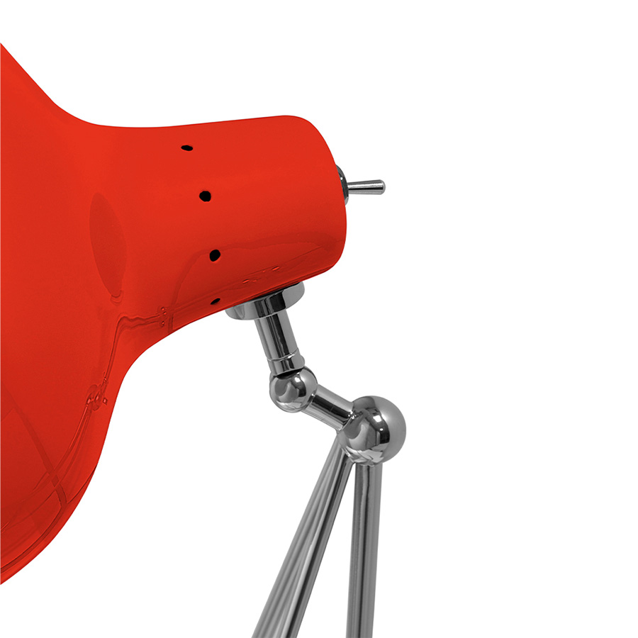 It is a handmade lamp built with materials such as brass and Aluminium. Brass was used on the body, whilst Aluminium was chosen for the shade. The Aluminium shade is lacquered a glossy red on the outside and matte white on the inside, while for the body a nickel-plated finish was chosen. However, both these colors and finishes can be customized according to your needs. having a movable and adjustable shade, that casts light to where it is needed.