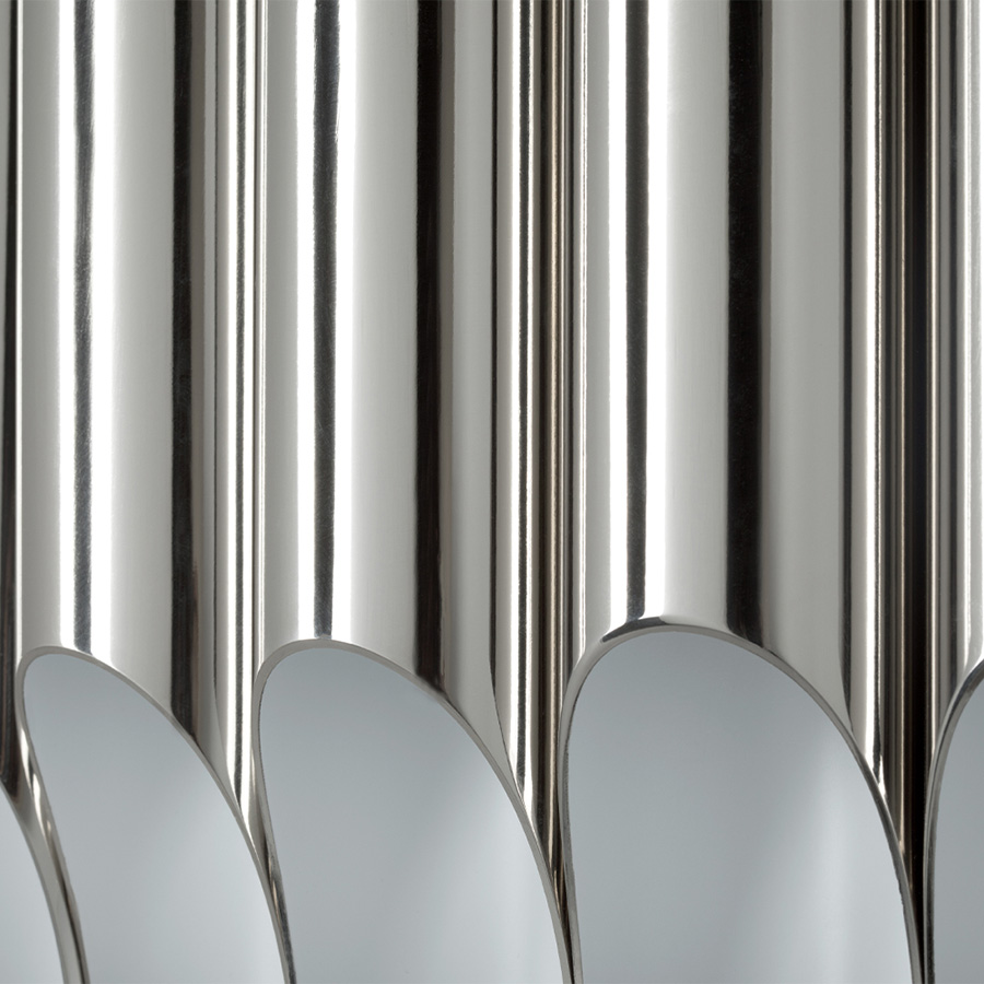 Galliano round chandelier is a mid-century modern light with a shape that was inspired by a pipe organ. This modern lighting design gets even more beautiful when you see the light being casted thought its pipes.Handmade in steel, this minimalistic suspension lamp is the perfect mix of form and function.