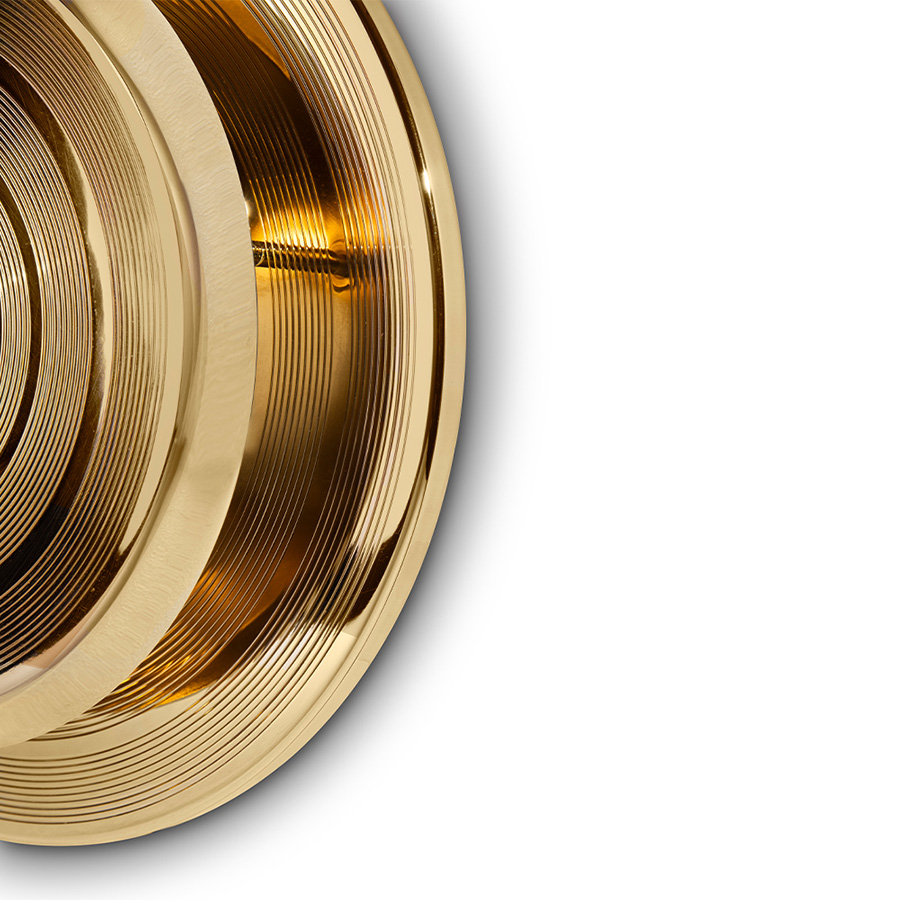 Hendrix wall sconce has a round shape that was inspired by a golden vinyl player. Ideal for every single mid-century modern interior, this wall light fixture will bring a smooth lighting effect to your room. 100% handmade in brass, Hendrix showcases a high quality craftsmanship. With a gold plated finish, this wall light has an avant-garde design perfect for modern and contemporary environments