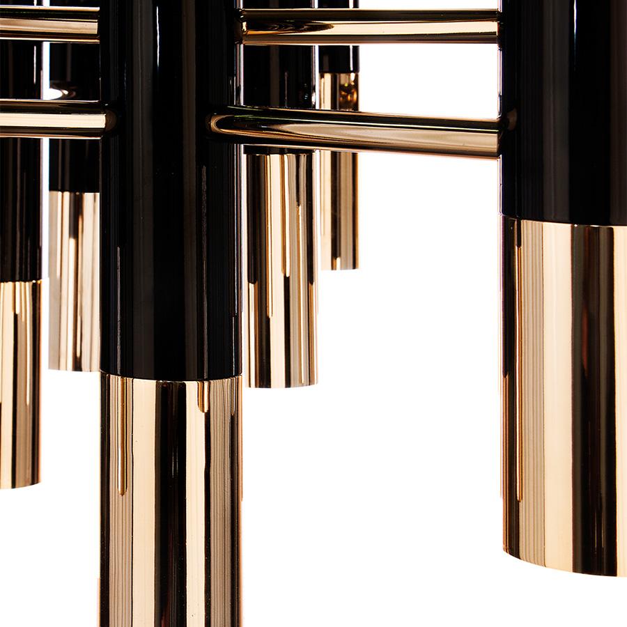 Ike suspension lamp has a distinctive but easily recognizable design, ideal for every single mid-century modern interior. With its clean lines, this dazzling lamp is handmade in brass and Aluminium, and it features a glossy black and gold plated finish, representing a high-quality craftsmanship. It is 15 inches tall, but its steel cord can be customizable.