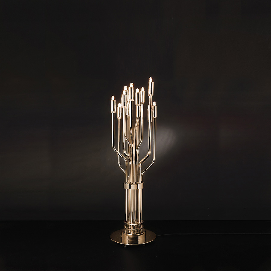 Janis is a mid-century modern table lamp inspired by one of the greatest female rock stars of the 20th century. Is a contemporary reinterpretation of the best mid-century lighting design classics. 100% handmade in brass by some of the finest artisans in Portugal, Janis has a gold-plated finish that comes to enhance its luxurious features. An unforgettable brass lighting design that sits well in a classic living room, or a modern entryway.