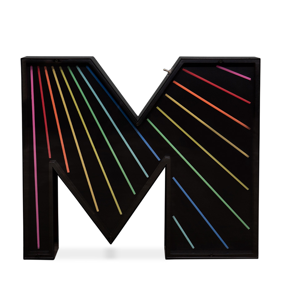 An eye-catching touch to a big, bold and bright marquee letter design. A unique way of bringing a unique, colourful and cheerful touch to any exterior or interior design project. With its stunning rainbow neon effect, this versatile lighting design can be placed in the wall or on the floor. Coming with a large anti-reflective acrylic panel to protect the neons this marquee letter design has 1 meter and its handmade in acrylic and Aluminium. Customizable on demand it's also available in a mini version, this marquee letter is perfect for a fun lobby.