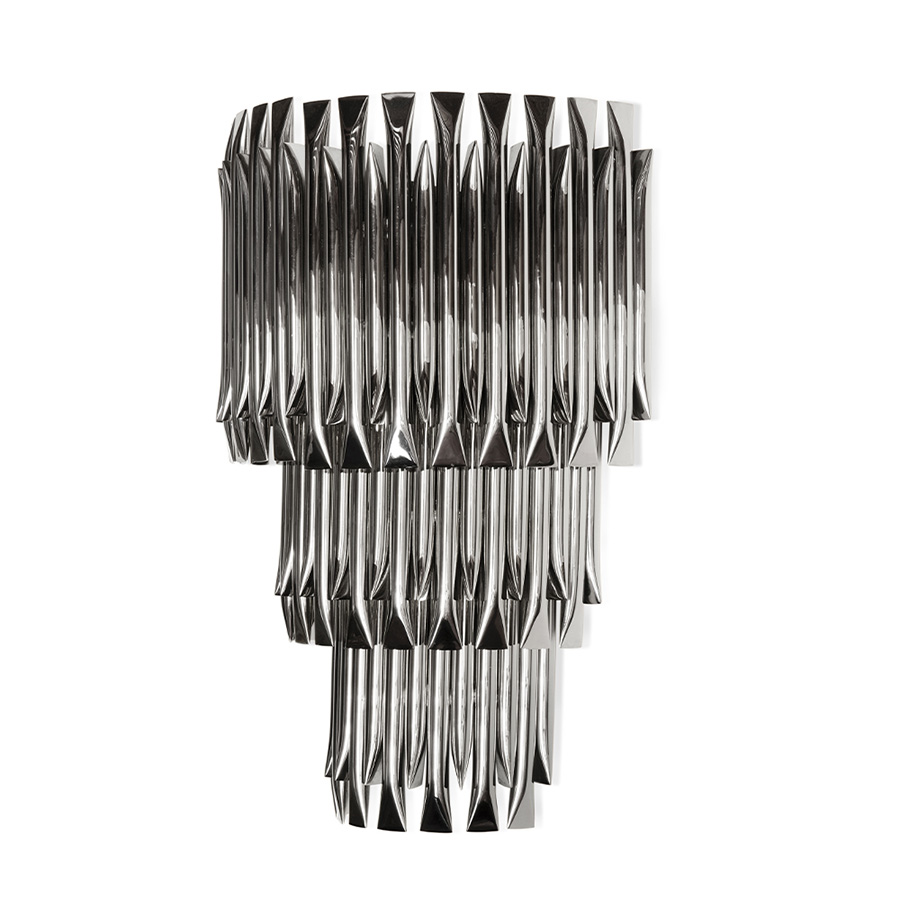 Matheny wall has a complex and attractive geometry design of combined tubes. In this variation, three of the original designs are combined on top of each other in a cascade of metal pipes to create a new impressive piece.This unique lamp combines a mid-century modern design with a classic style to make a statement. A modern wall light 100% handmade in brass with a brushed nickel finish. With 4 lamps, we recommend you to use G9 bulbs.