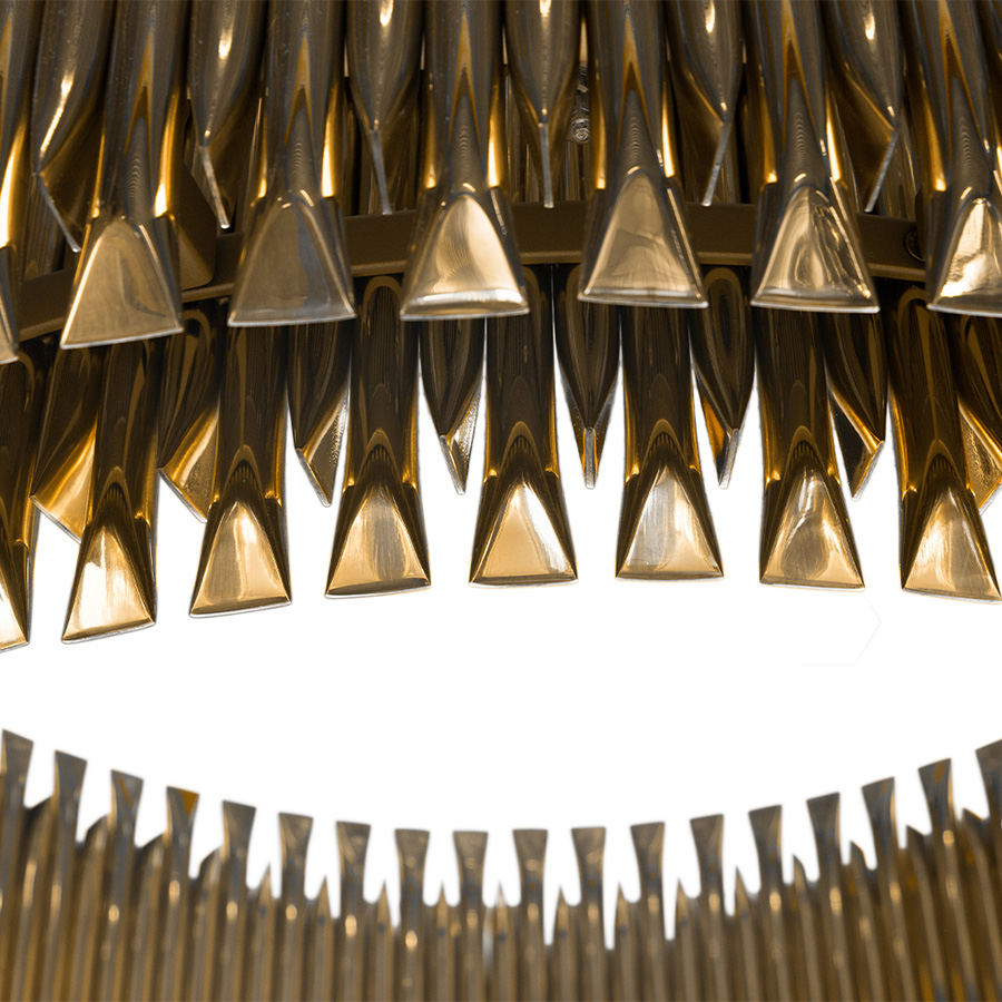Feel the true statement of luxury with this modern ceiling lamp. Matheny is a unique chandelier, a new take on the mid-century classics. It has a geometric design of combined tubes and its structure is handmade in brass. Its shape is round and is composed by golden tubes, which reflect the sophistication of a timeless iconic lamp.