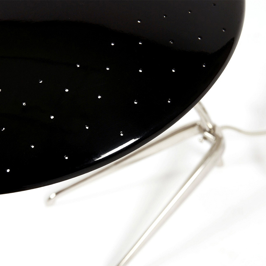 Is a design by DelightFULL that successfully showcases the merge between mid-century design and the contemporary influences of today’s world. It boasts a stunning brass body with a nickel plated finish, and an Aluminium-built shade lacquered a glossy black on the outside and a matte white on the inside, so as to not reflect the light in an uncomfortable way. An easy way to bring style into your master bedroom.