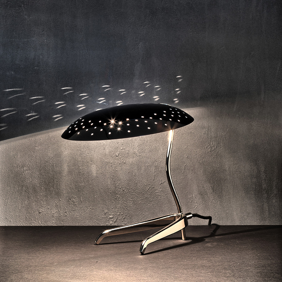 Is a design by DelightFULL that successfully showcases the merge between mid-century design and the contemporary influences of today’s world. It boasts a stunning brass body with a nickel plated finish, and an Aluminium-built shade lacquered a glossy black on the outside and a matte white on the inside, so as to not reflect the light in an uncomfortable way. An easy way to bring style into your master bedroom.