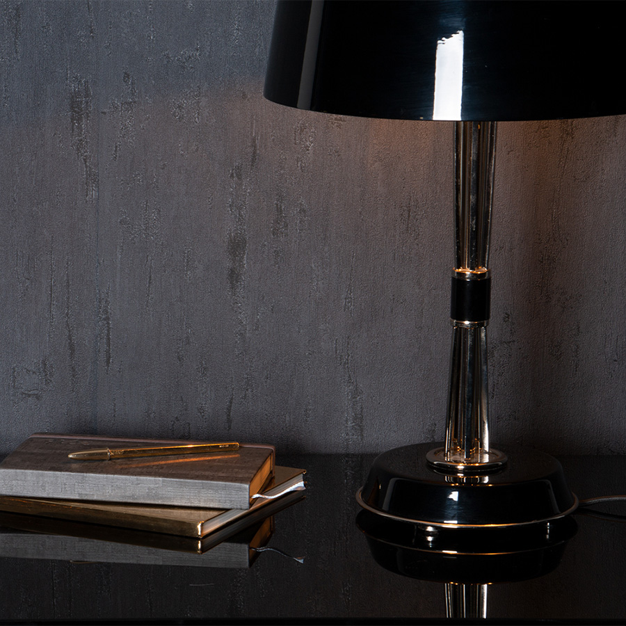 Miles table lamp is a classic mid-century modern table lamp, which brings back the sophisticated atmosphere of the 50s. The body has a copper plated finish for a more contemporary look, while the shade is lacquered a matte black on the outside and a white matte on the inside.It is essentially a copper table lamp that casts a soft glaze that will suit your modern entryway in the most flattering way.