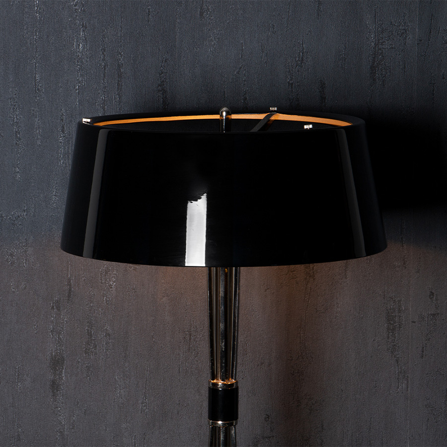 Miles table lamp is a classic mid-century modern table lamp, which brings back the sophisticated atmosphere of the 50s. The body has a copper plated finish for a more contemporary look, while the shade is lacquered a matte black on the outside and a white matte on the inside.It is essentially a copper table lamp that casts a soft glaze that will suit your modern entryway in the most flattering way.