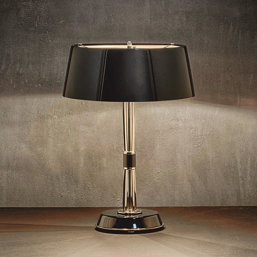Miles table lamp is a classic mid-century modern table lamp, which brings back the sophisticated atmosphere of the 50s. The body has a copper plated finish for a more contemporary look, while the shade is lacquered a matte black on the outside and a white matte on the inside.It is essentially a copper table lamp that casts a soft glaze that will suit your modern entryway in the most flattering way.