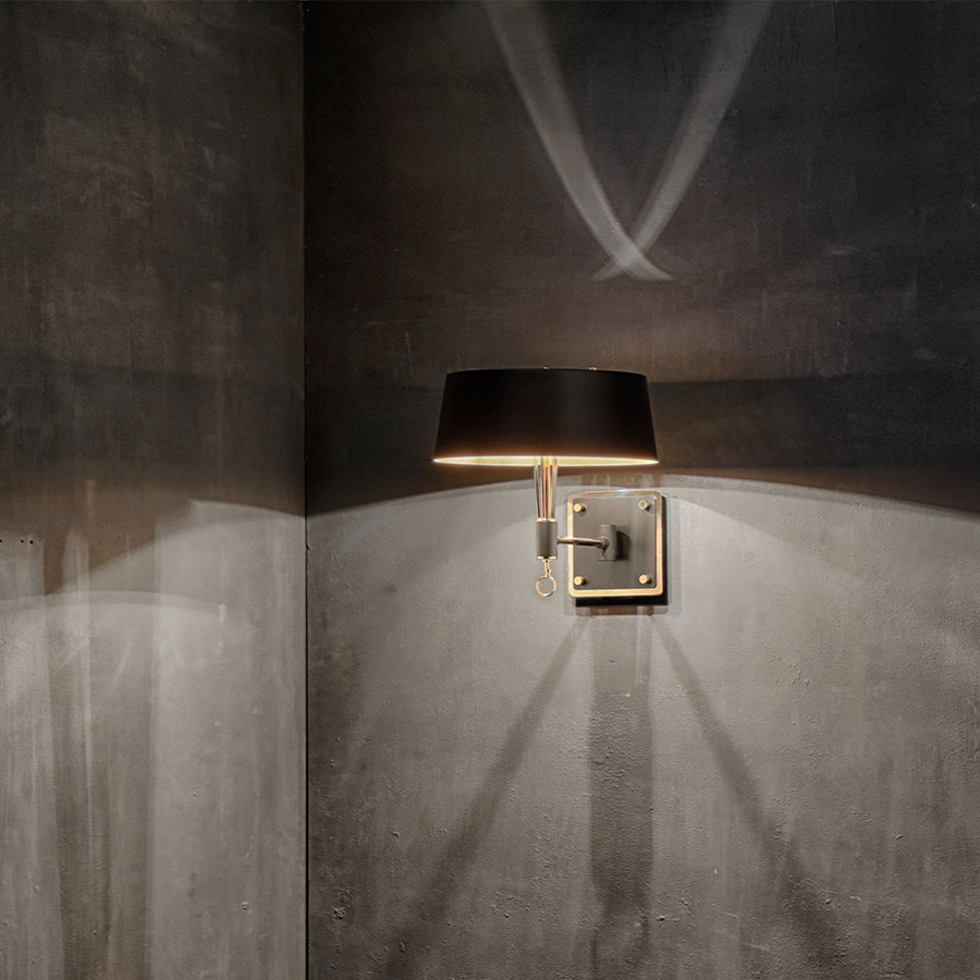 Miles wall lamp was inspired in one of the most influential and acclaimed figures in the history of jazz and 20th century music: Miles Davis. This modern wall light has the purpose to represent the impressive charisma of this outstanding jazz singer, in its innovative and sophisticated lighting features. Miles black wall sconce features a structure made in brass and the lamp shade in Aluminium.