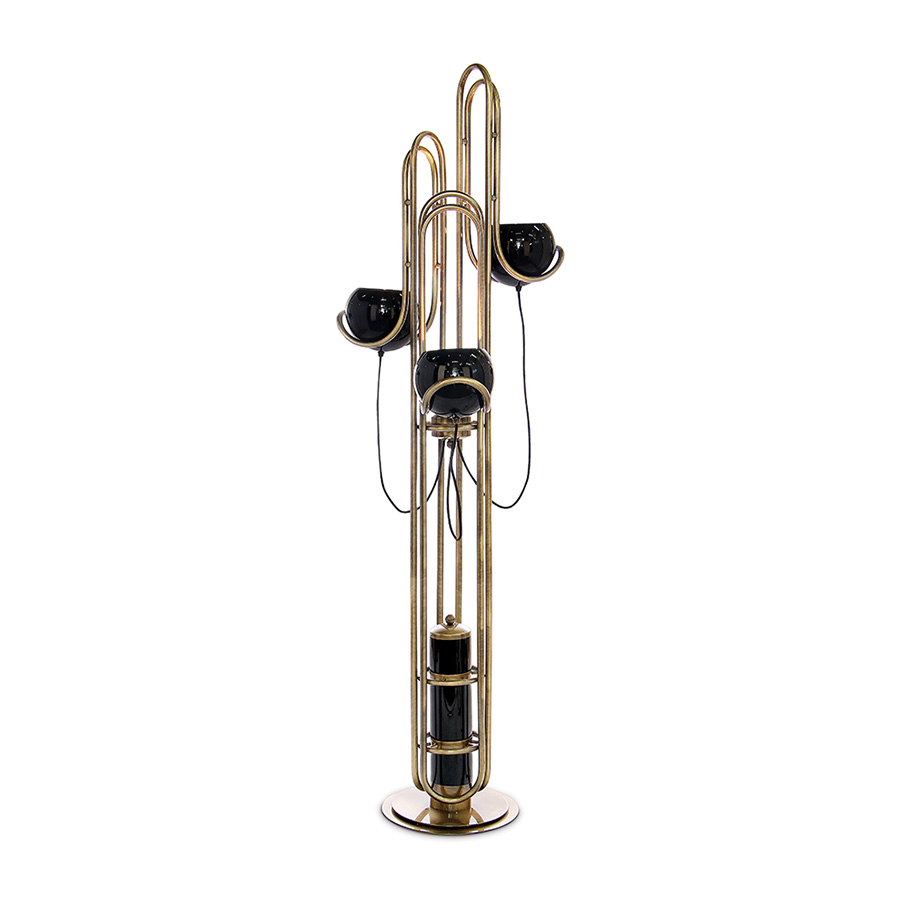 Neil floor lamp is a reminiscent lamp of the golden years of space. Around, brass base secures a black matte stem reaching up into three glossy black finished lampshades with a futuristic style. The three arms with flexible lights provide a good peripheric light range. The elegance of the continuous flowing center tubes gives a floating sensation to the whole piece, that would be perfect in a retro style living room next to a lounge chair or in a luxurious lobby.