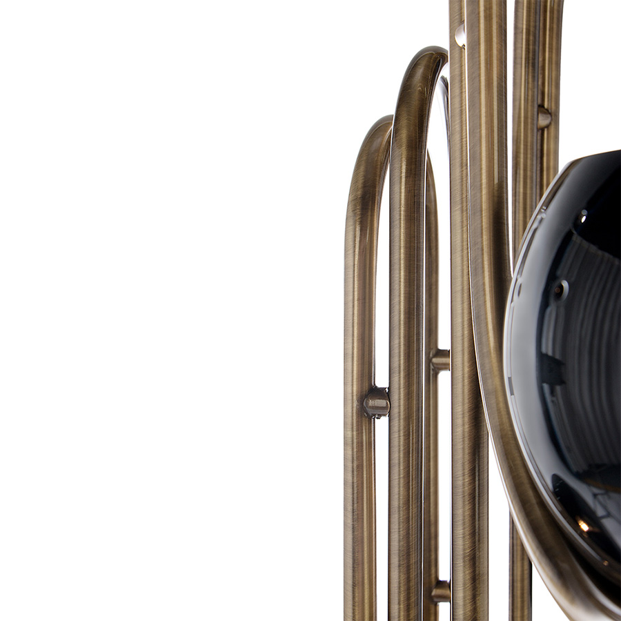 Neil floor lamp is a reminiscent lamp of the golden years of space. Around, brass base secures a black matte stem reaching up into three glossy black finished lampshades with a futuristic style. The three arms with flexible lights provide a good peripheric light range. The elegance of the continuous flowing center tubes gives a floating sensation to the whole piece, that would be perfect in a retro style living room next to a lounge chair or in a luxurious lobby.