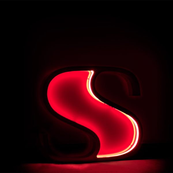 Standing for summer, sleekness, and style, this exuberating marquee letter design stands to make an appearance in any home decor project. The energy of the neon pink lit core creates a soothing lighting effect in a serene interior or exterior space. Handmade in Aluminium and stainless steel the purple tone is mixed with the materials to create a one of a kind lighting design.