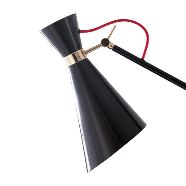 This modern lamp has three lamp shades in Aluminium that feature a glossy black finish and three visible textile red wires above the large lamp shades. The three arms are united by a gold plated ring, showing a high level craftsmanship. The big lampshades,the asymmetric structure the visible textile wire and the nickel plated details have resulted in a huge pendant lamp which will surely put a spell on you.