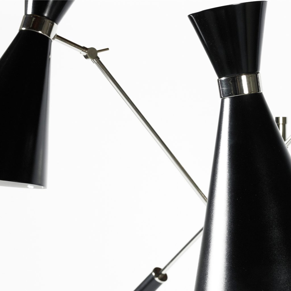 Stanley floor light is a style icon of the fifties and sixties. With the possibility of having 1 to 3 moveable arms, this vintage style floor lamp will add effortless style to your mid-century modern reading nook. The 3-light floor lamp holds three boom arms, creating custom light effects due to its glossy black & matte white lamp shades. Each shade is balanced by a weighted handle.