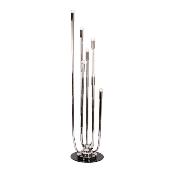 Stardust floor lamp is a mid-century modern revolving lamp that was inspired by the cosmic orbits. The main goal of this lighting design is to light up your mid-century modern home just like the stars do it at night. Constructed out of brass tubing into a rounded oblong shape, this modern floor lamp will shine brightly due to the light cast by the bulbs arranged in the same way as a candelabra.