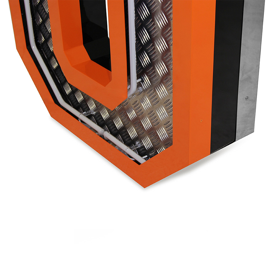 Inspired by the great 70's, the geometric lines and the exterior orange underlines that contour the Aluminium fixture is a sign of the times ahead. Covered with diamond plated steel that reflects the white neon glow of the marquee lighting design is the ones to characterizes this lighting fixture. Creating a new aura in any design project, this handmade lighting design has a 1 meter in height.